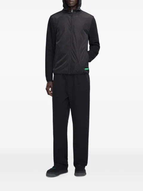 FLÂNEUR Badge Technical panelled zip-up jacket